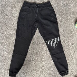 Asrv joggers with script text on knee